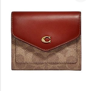 Coach purse and wallet!! Got for Christmas. Used a handful of times.